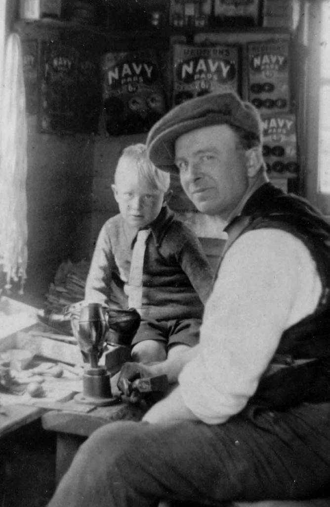 Mr Prebble and son in the shoe repair workshop, which is still on the end of the house