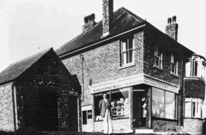 Mr. Tom Clayson outside of his new Post Office opened in 1938